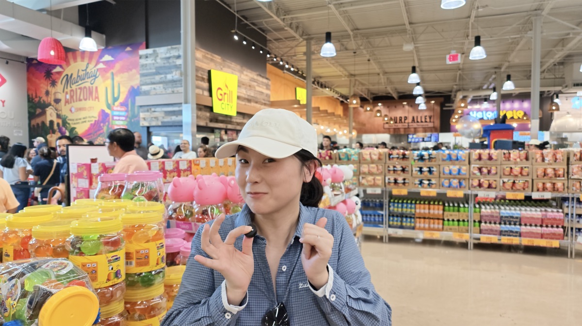Posing inside Seafood City Chandler near the Mabuhay Arizona mural, excited about the haul