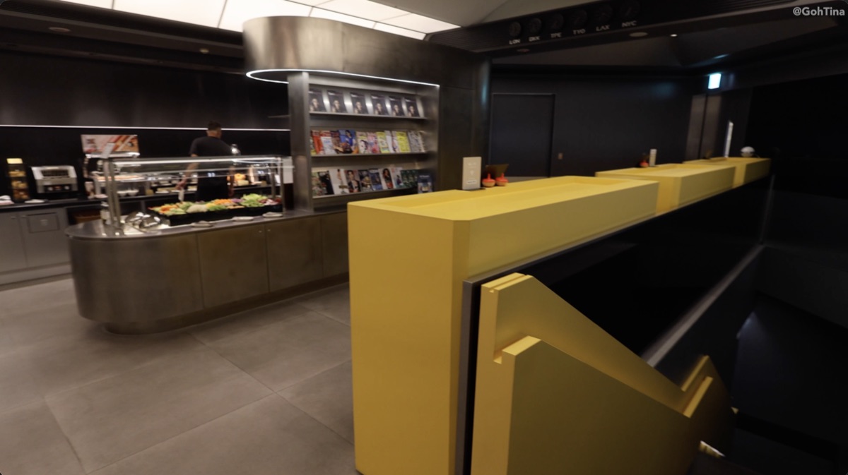 Buffet area and staircase down to the lower level at the Starlux Galactic Lounge