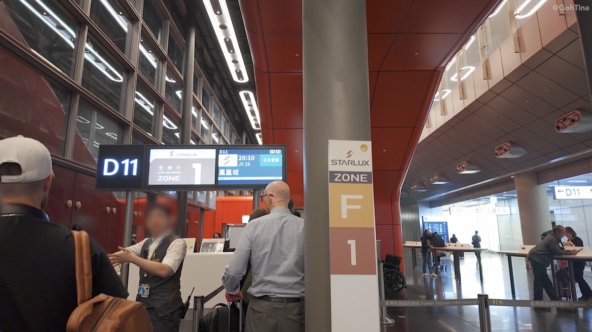 Zone 1 priority boarding at gate D11 for the Starlux flight to Phoenix
