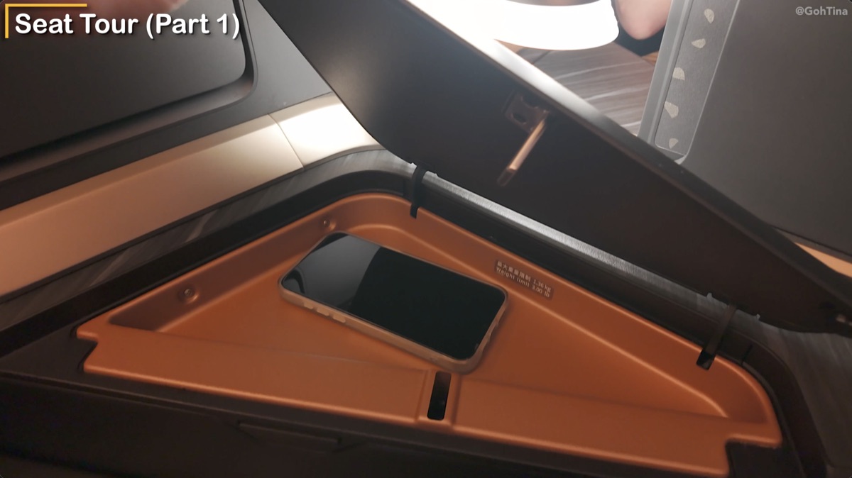 Phone storage nook beside the Starlux business class seat