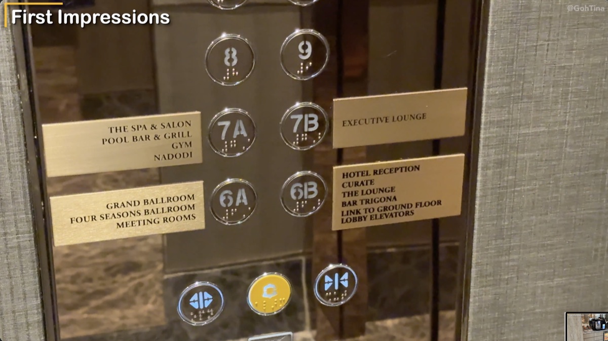 Elevator directory showing the spa, gym, pool bar, executive lounge, and Curate