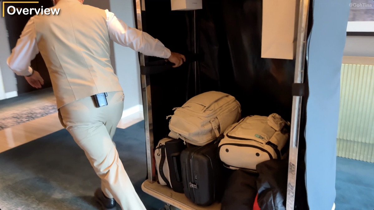 Staff moving our luggage and bags to the new Premier Park View room