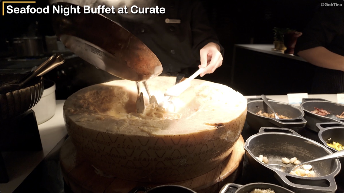 Pasta cooked table side on a wheel of cheese