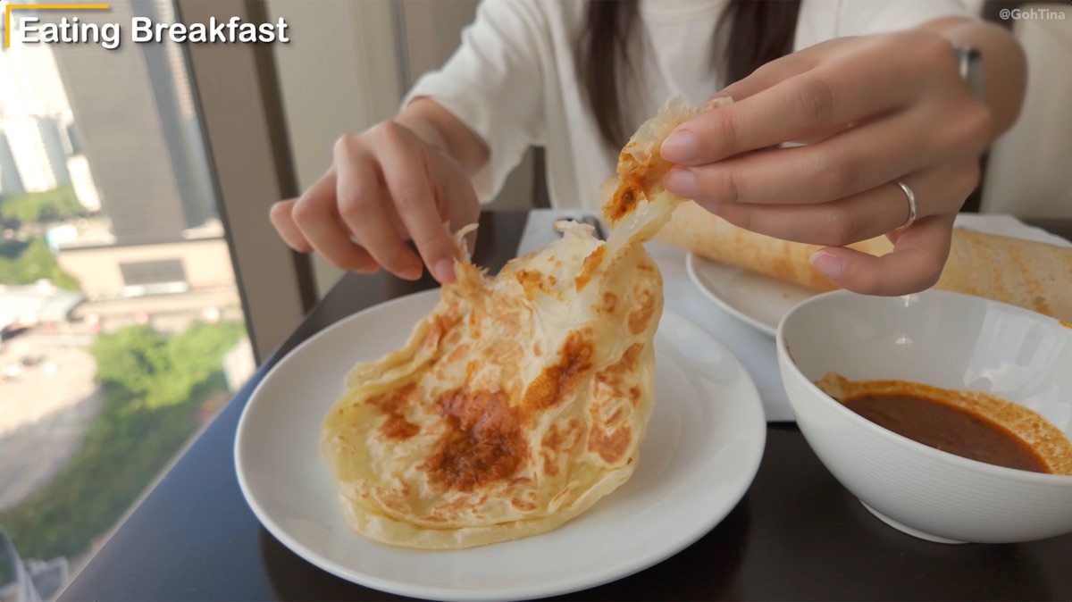 Eating roti canai at Thirty8 breakfast buffet
