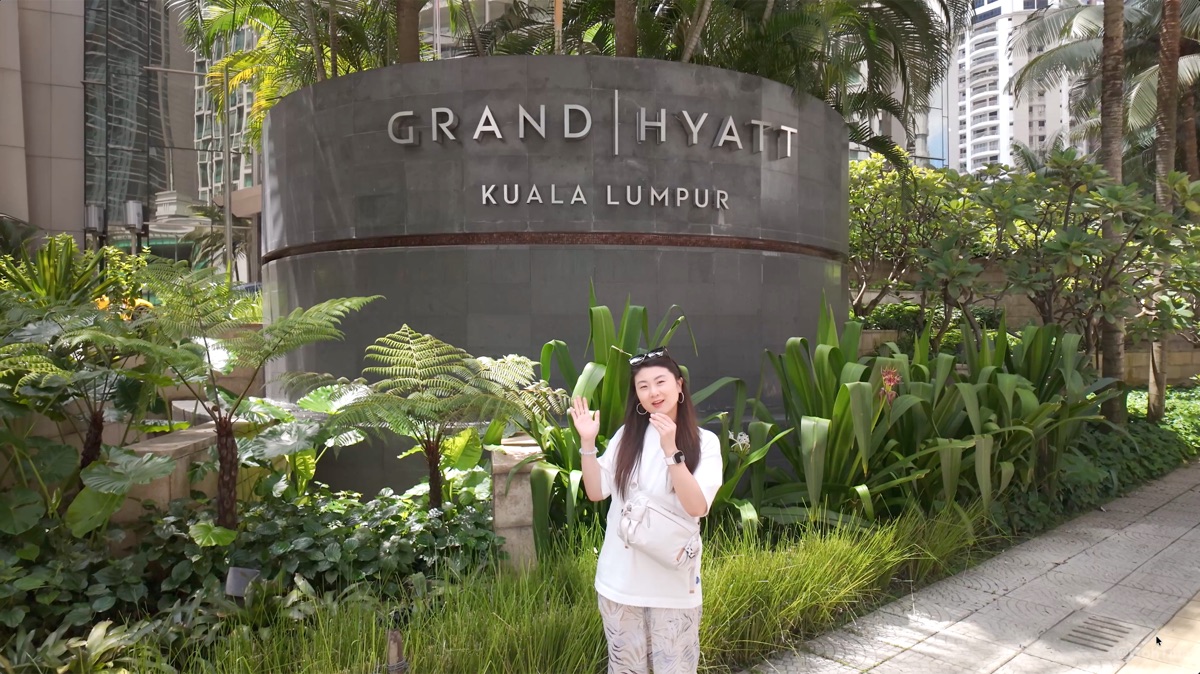 Standing outside the Grand Hyatt Kuala Lumpur entrance