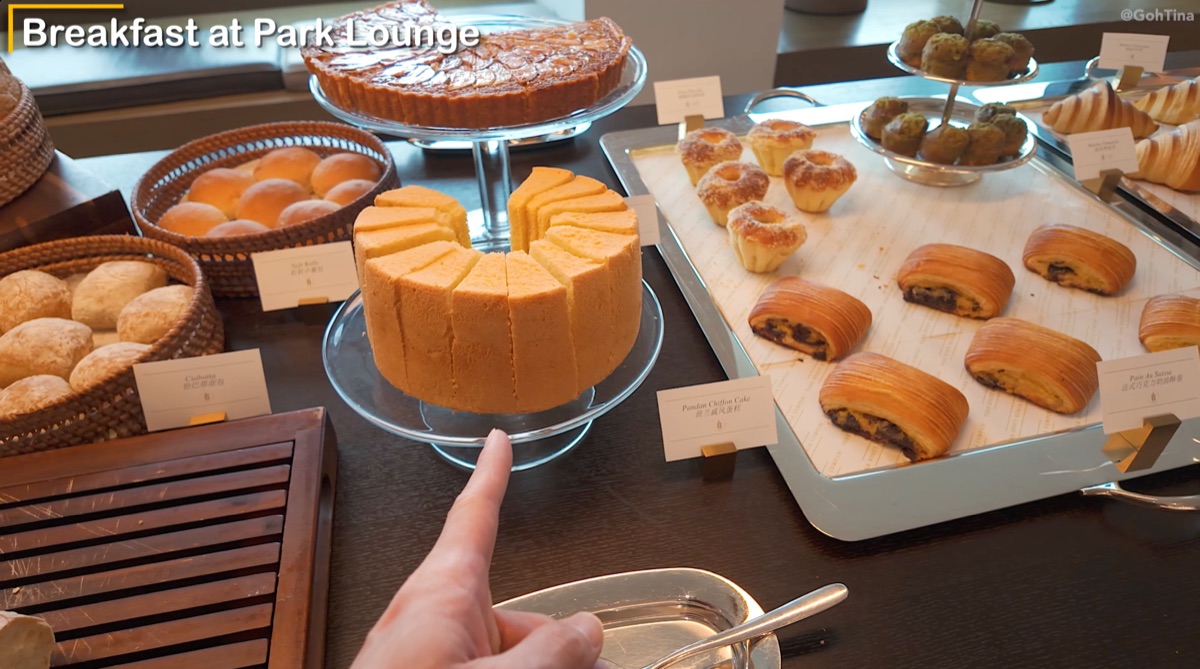 Fresh baked breads and pandan chiffon cake at the breakfast buffet