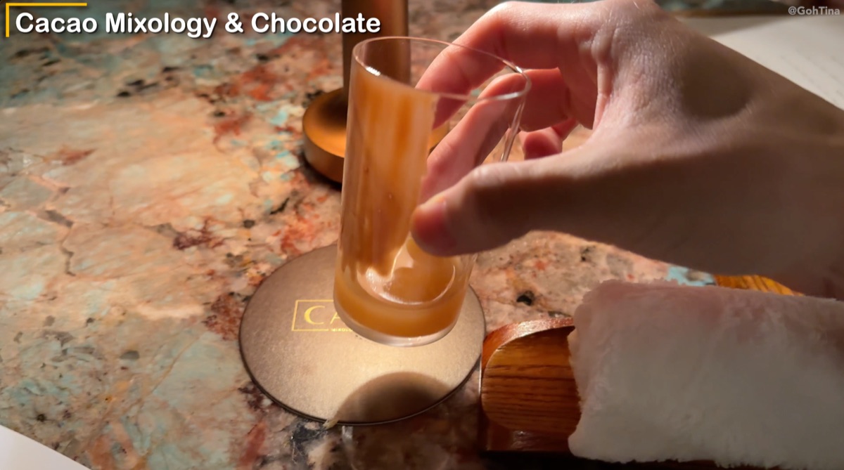 Kombucha and chocolate palate cleanser with a warm towel