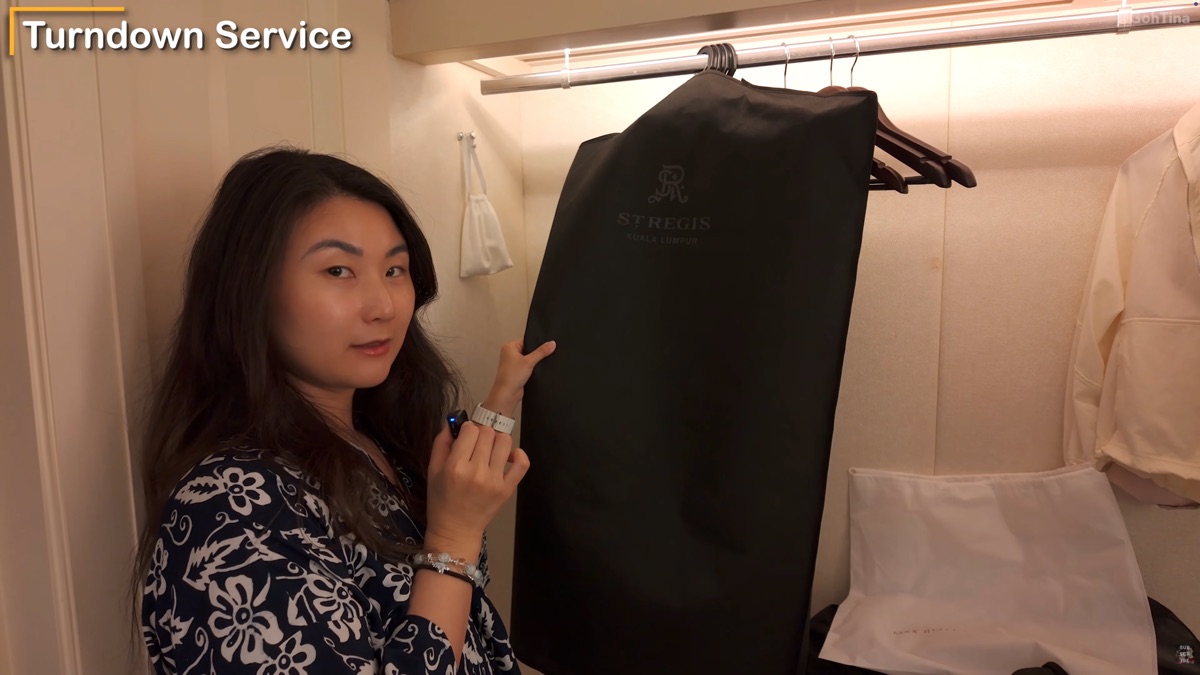 Pressed clothes hung in the closet after using the complimentary pressing service