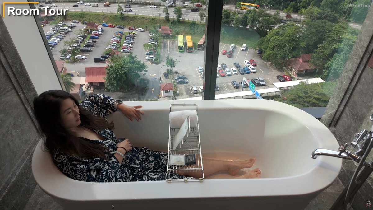 Tub with TV built into the mirror across from it