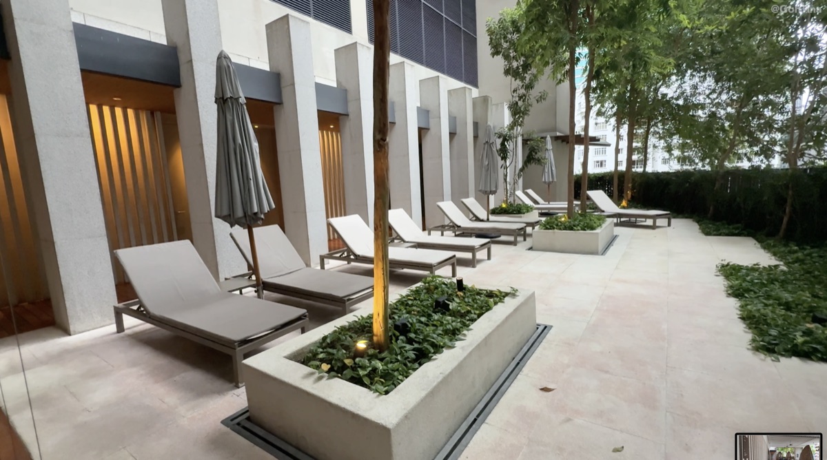 Outdoor lounging area with greenery