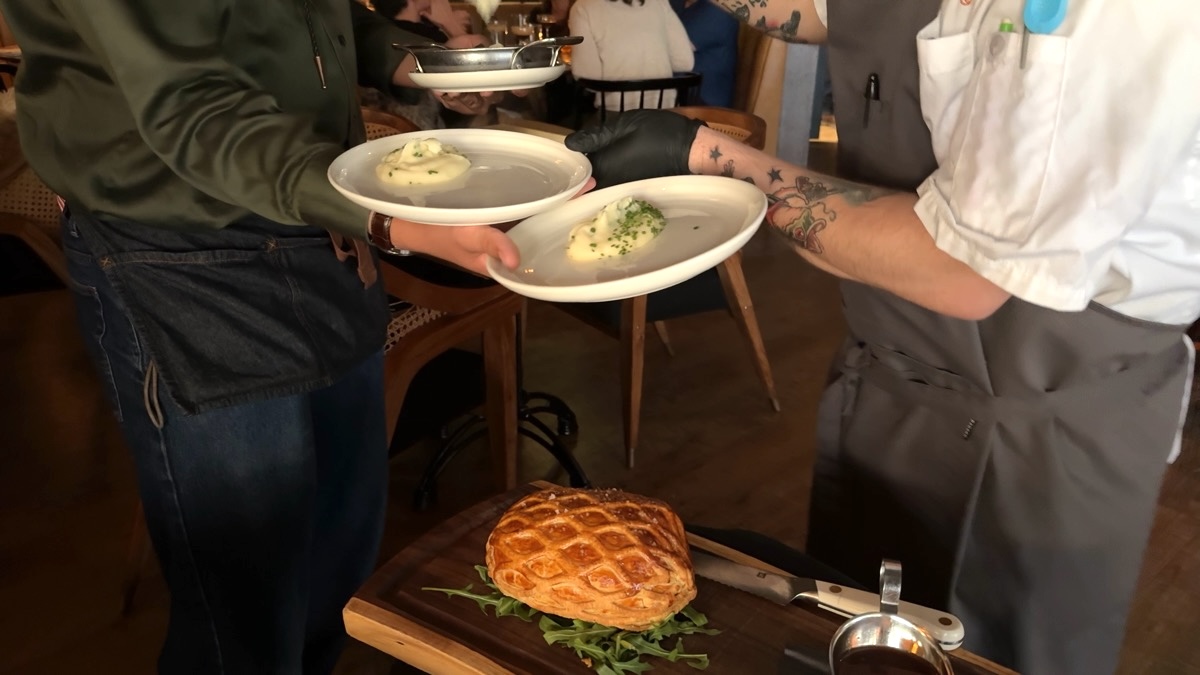 Wren and Wolf beef wellington being cut